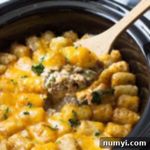 This Slow Cooker Bacon Cheeseburger Tater Tot Casserole is made from scratch without any canned soups! It's creamy, comforting and a one dish dinner!