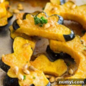 This Parmesan Roasted Acorn Squash is an easy savory side dish. It uses simple ingredients and even roasts the seeds!