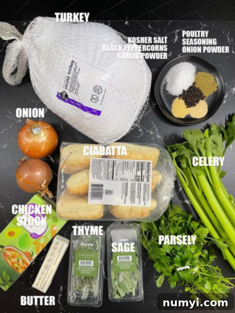 Ingredients needed to make spatchcock turkey with stuffing laid out on a kitchen counter.