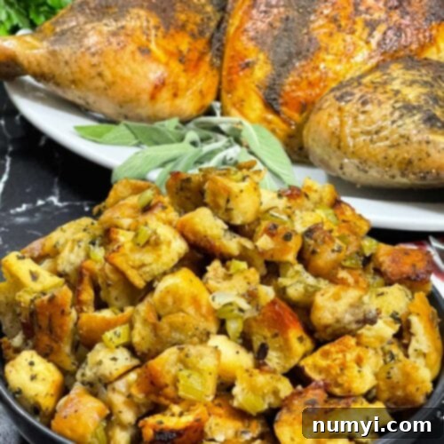Close-up of a rustic, savory stuffing, golden-brown and infused with herbs, perfect for a holiday meal.