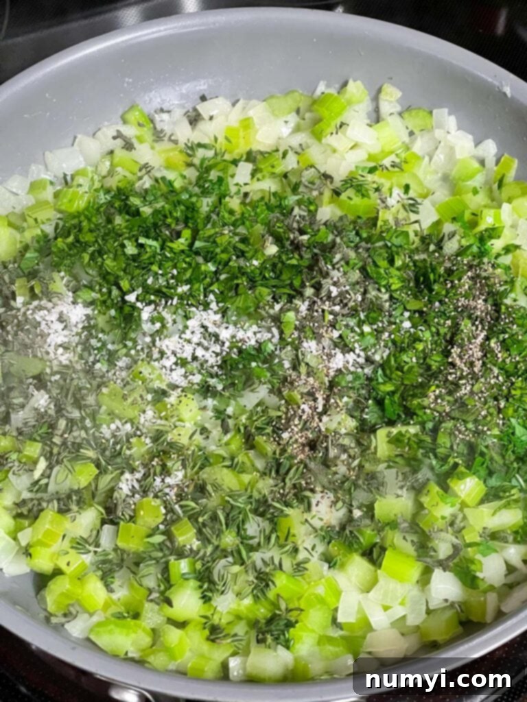 Sweated onion and celery in a skillet with a generous addition of fresh parsley, sage, and thyme.