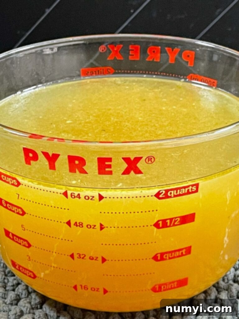 Turkish Noodle Soup 5 Strained homemade turkey stock in a glass measuring cup